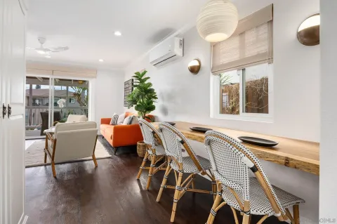 a very nice looking dining room with a table and chairs