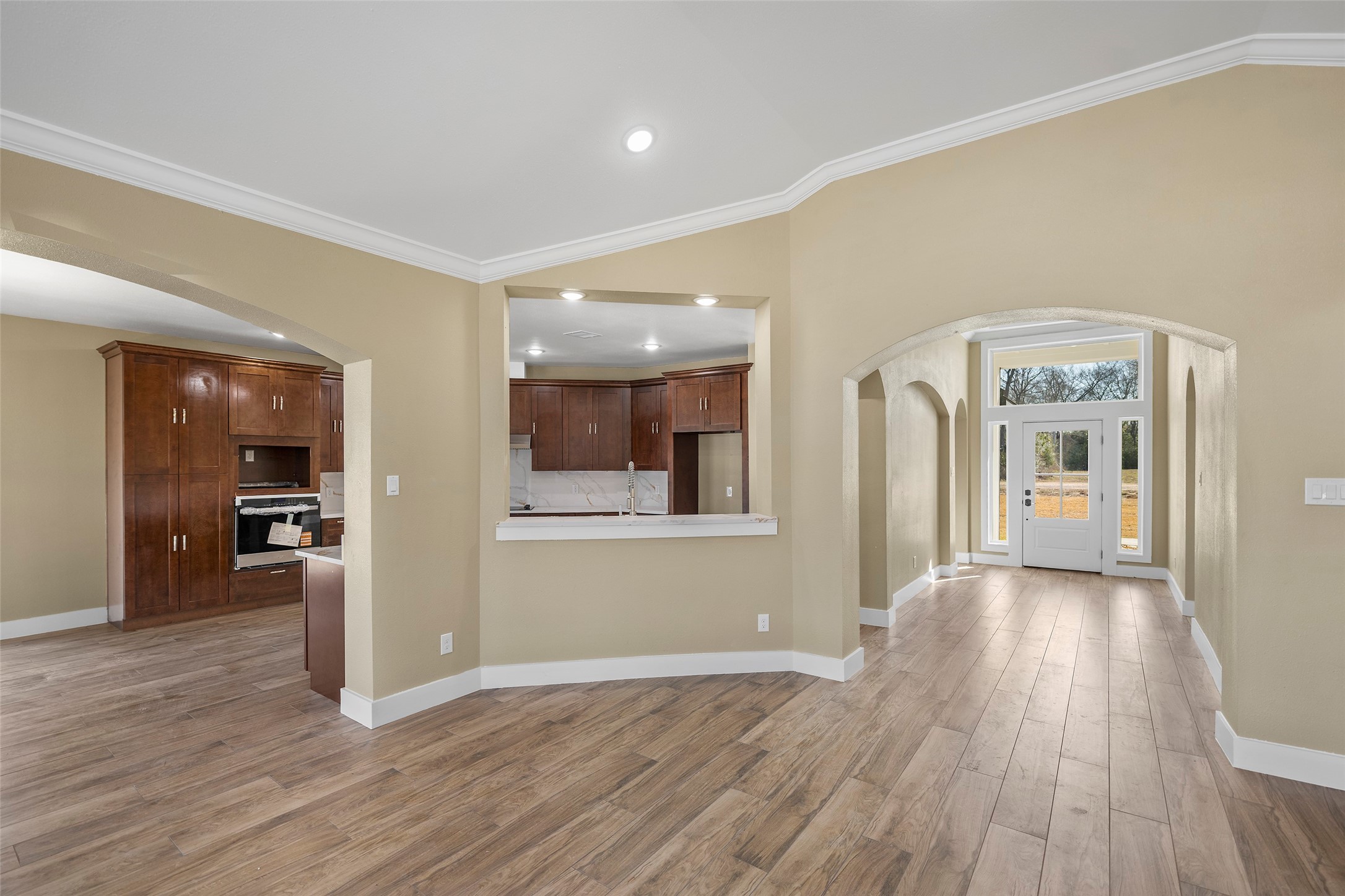 24630 Cavan Street Hempstead, TX 77445 - Photo 13 of 31 a view of a hallway with wooden floor and a cabinet