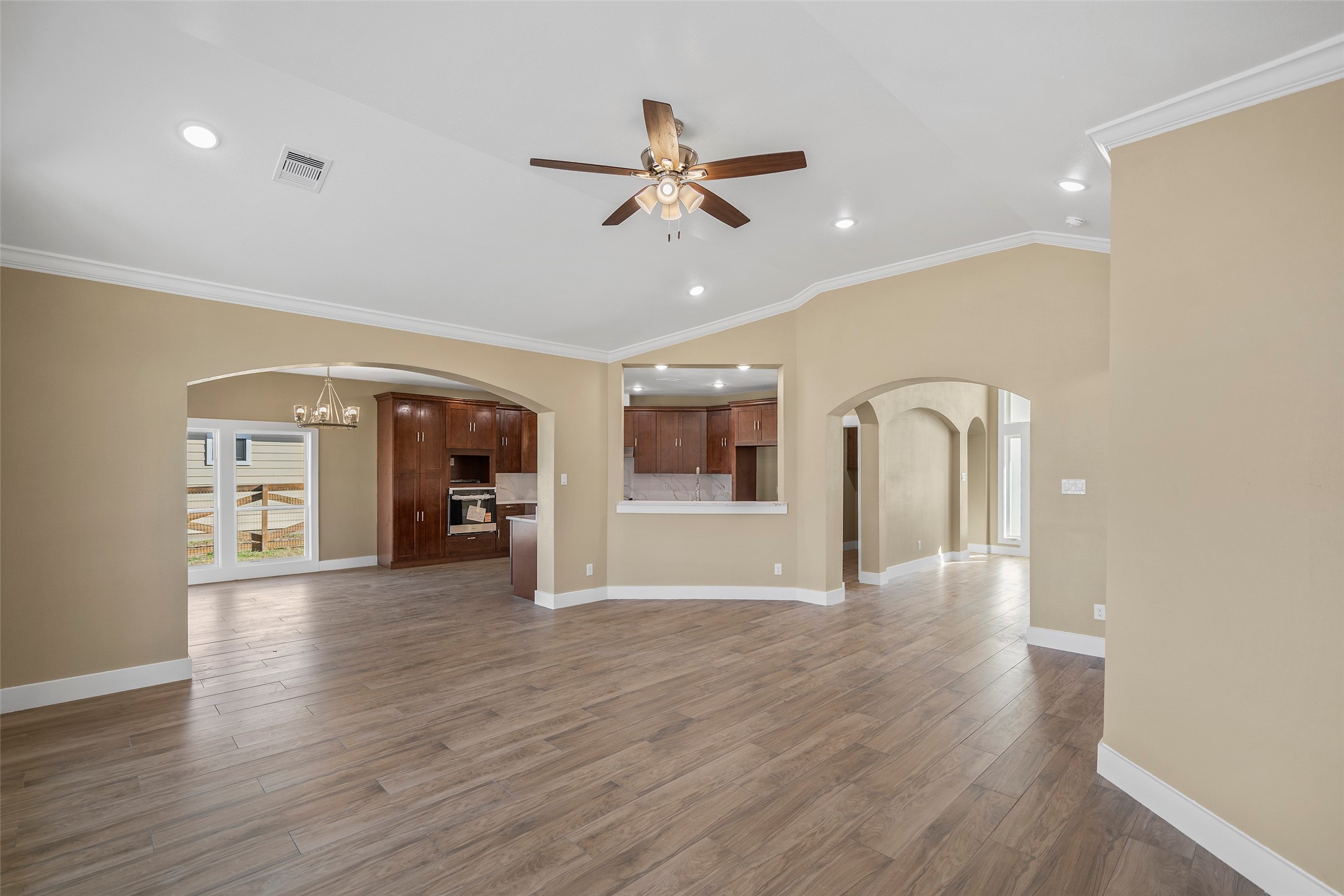 24630 Cavan Street Hempstead, TX 77445 - Photo 17 of 31 a view of an empty room with wooden floor and a ceiling fan