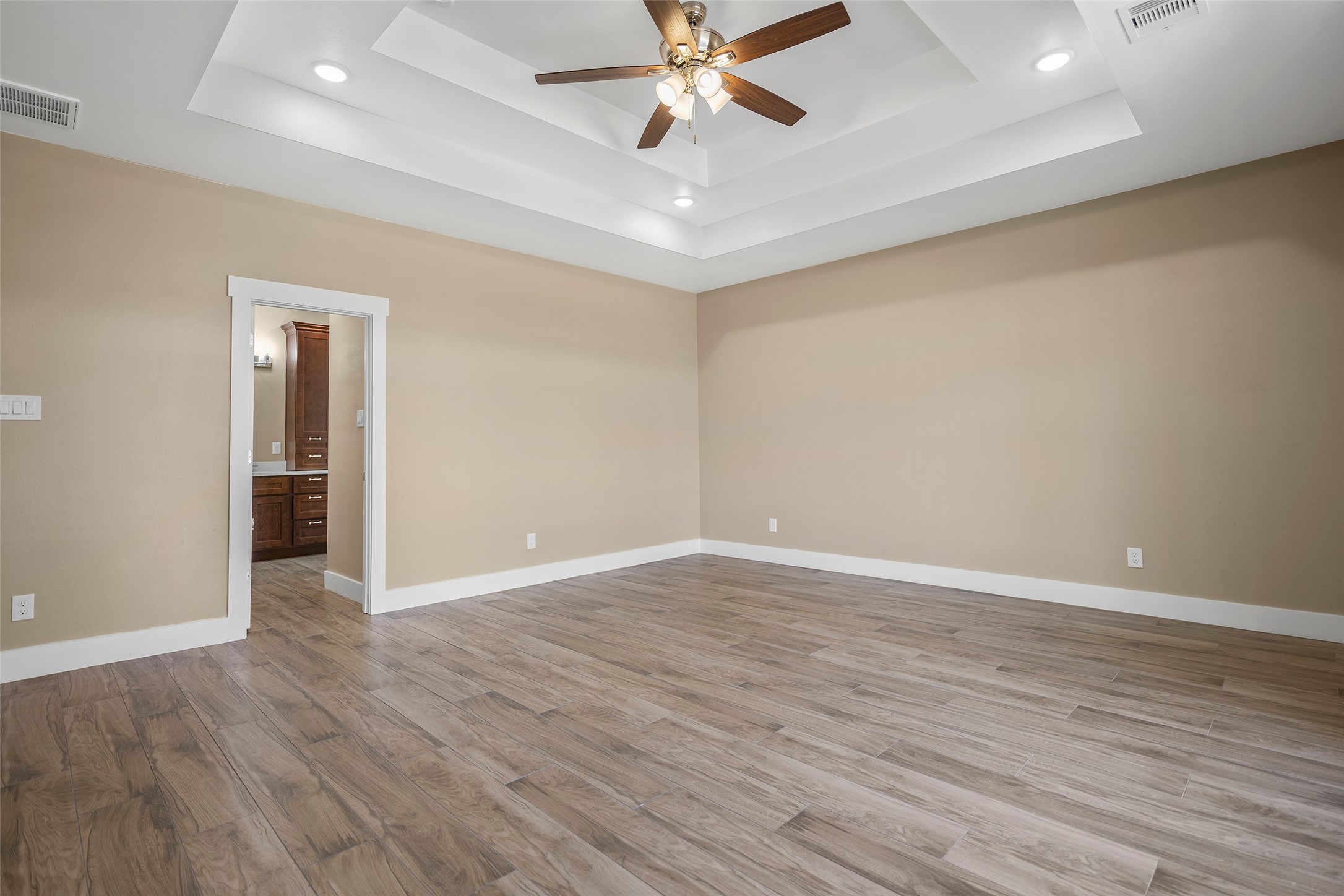 24630 Cavan Street Hempstead, TX 77445 - Photo 23 of 31 a view of an empty room with wooden floor