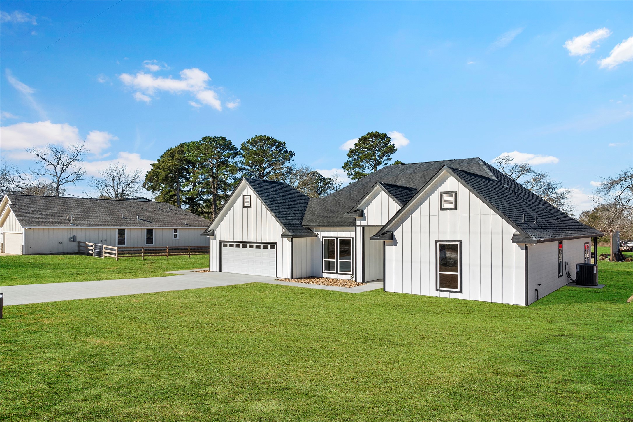 24630 Cavan Street Hempstead, TX 77445 - Photo 29 of 31 a view of a big house with a big yard and potted plants