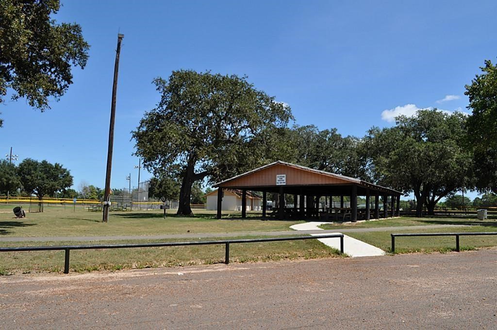 24630 Cavan Street Hempstead, TX 77445 - Photo 35 of 36 a swimming pool with outdoor seating and yard