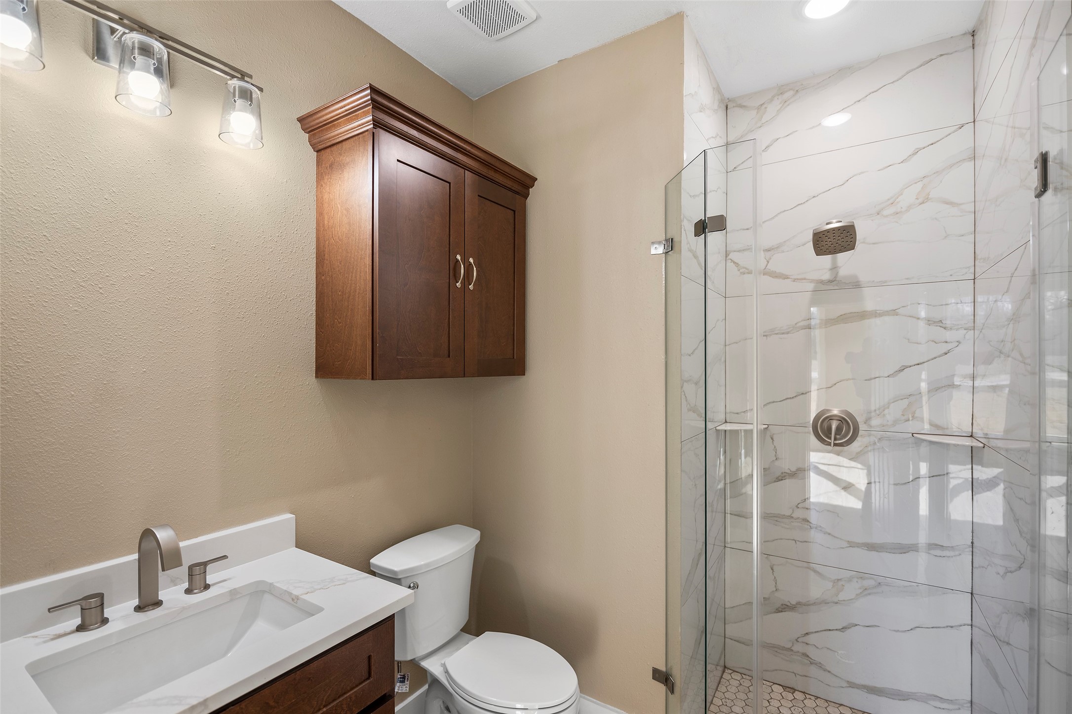 24630 Cavan Street Hempstead, TX 77445 - Photo 6 of 31 a bathroom with a toilet sink and shower
