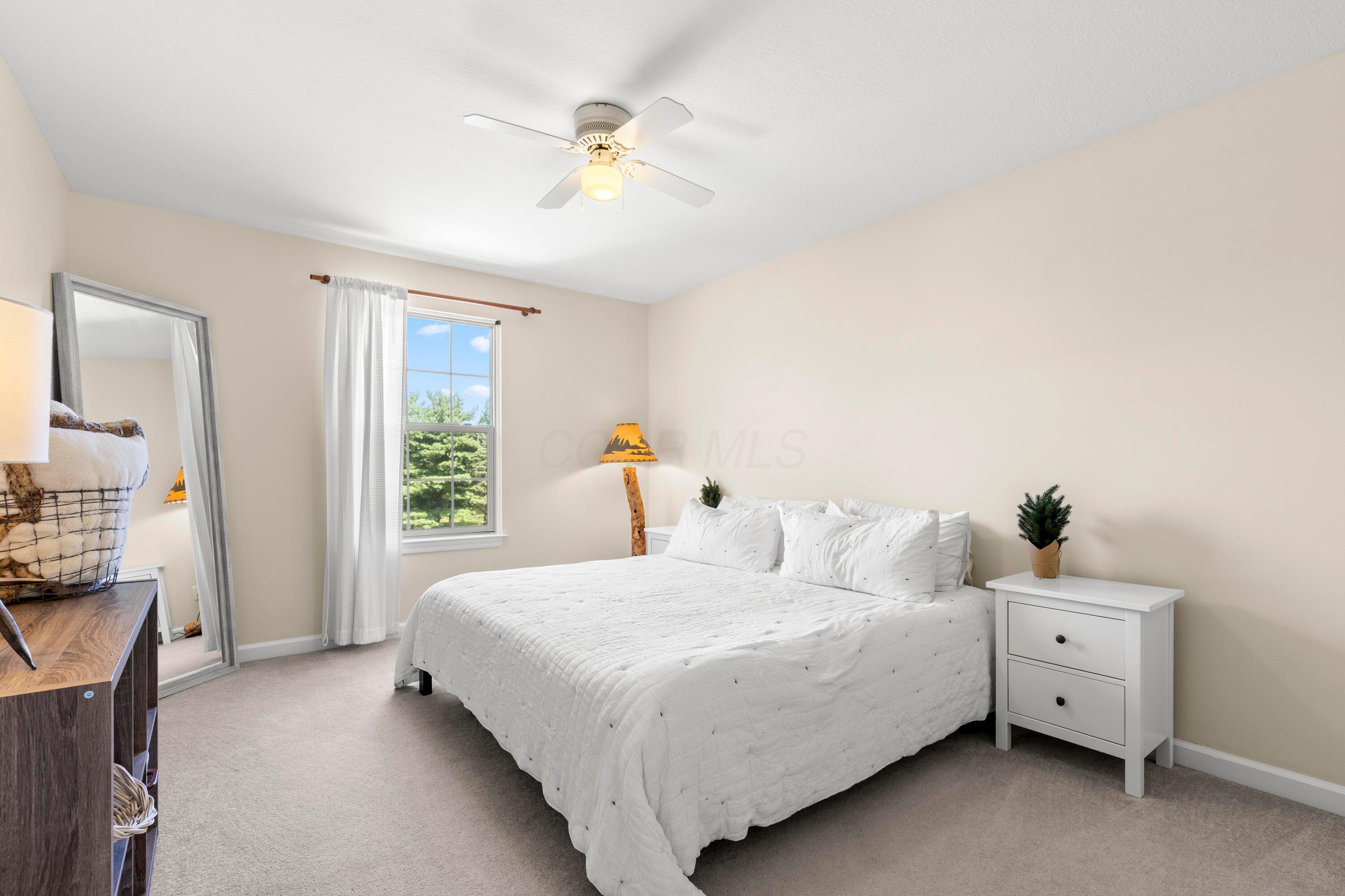 1515 Dale Ford Road Delaware, OH 43015 - Photo 41 of 74 • Light sand carpet • Ivory painted walls • Lighted ceiling fan