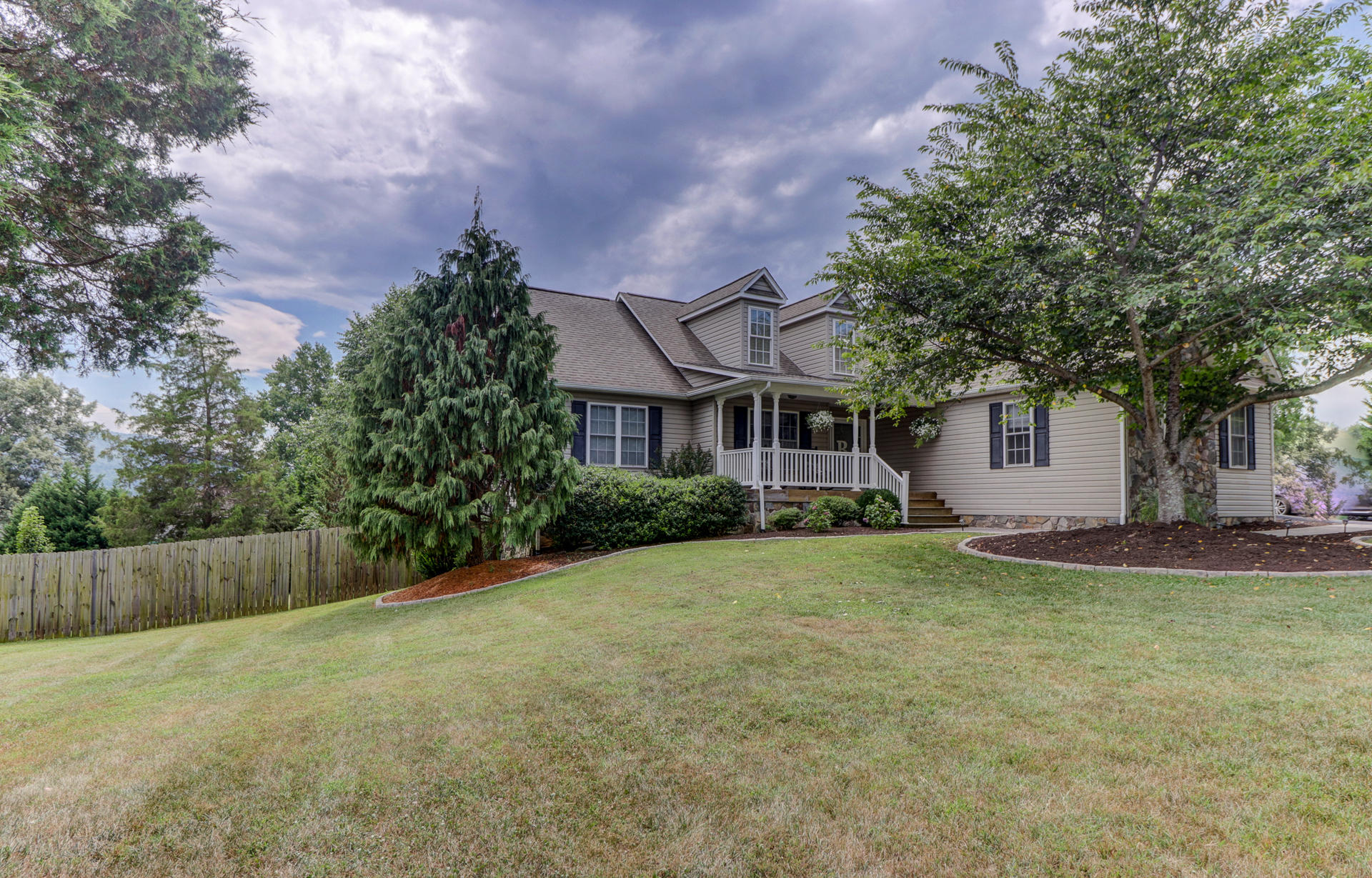 1275 Virginia Ridge Drive Hardy, VA 24101 - Photo 41 of 44 a front view of a house with a yard and garage