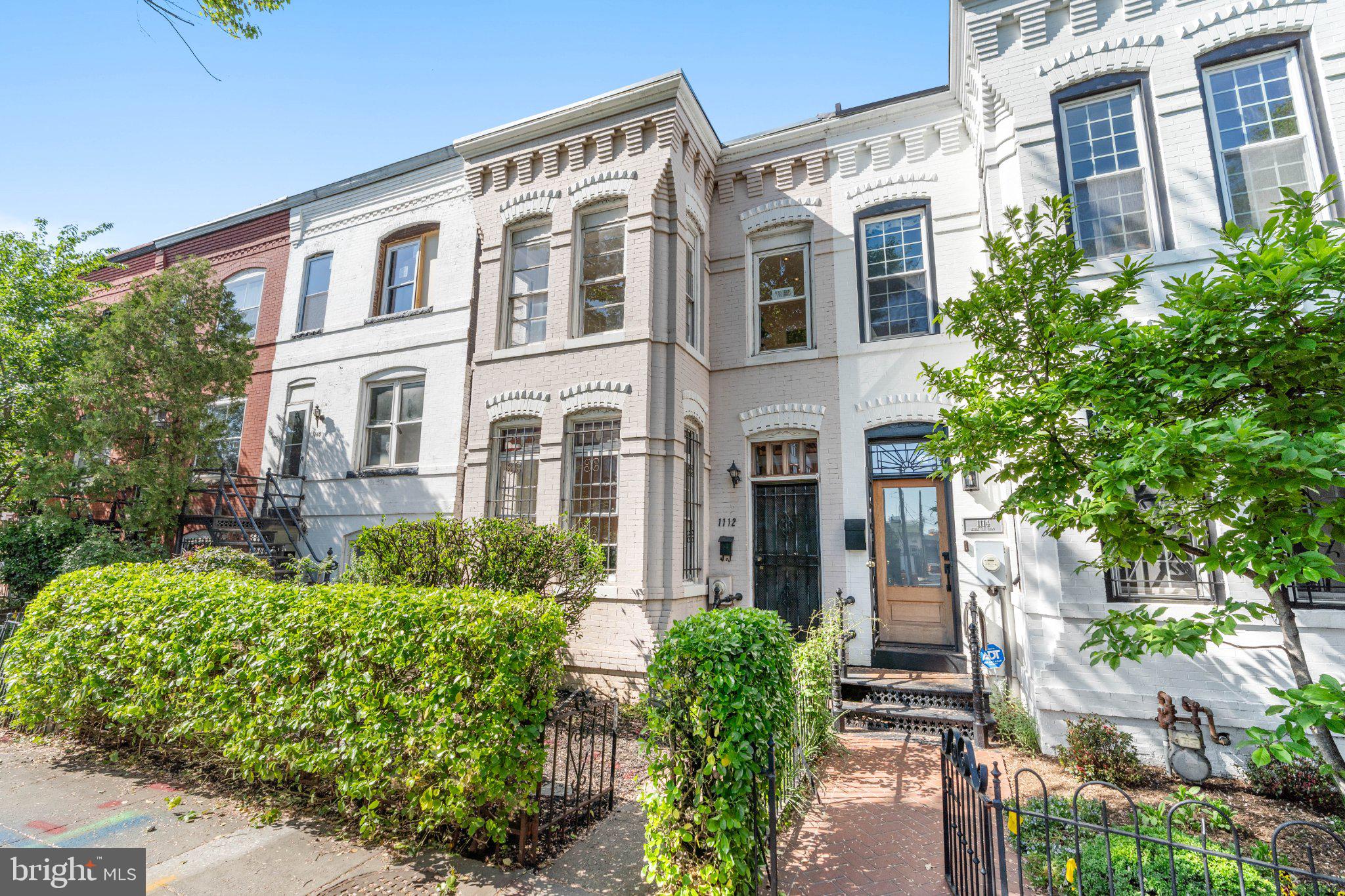 1112 I Street Southeast Washington, DC 20003 - Photo 1 of 42 Charming urban residence with lush greenery.