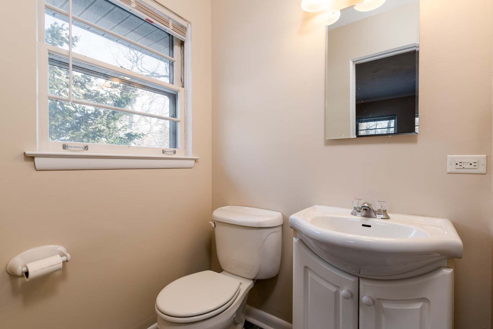 27W420 Manchester Road Winfield, IL 60190 - Photo 16 of 24 a bathroom with a sink a toilet and a window