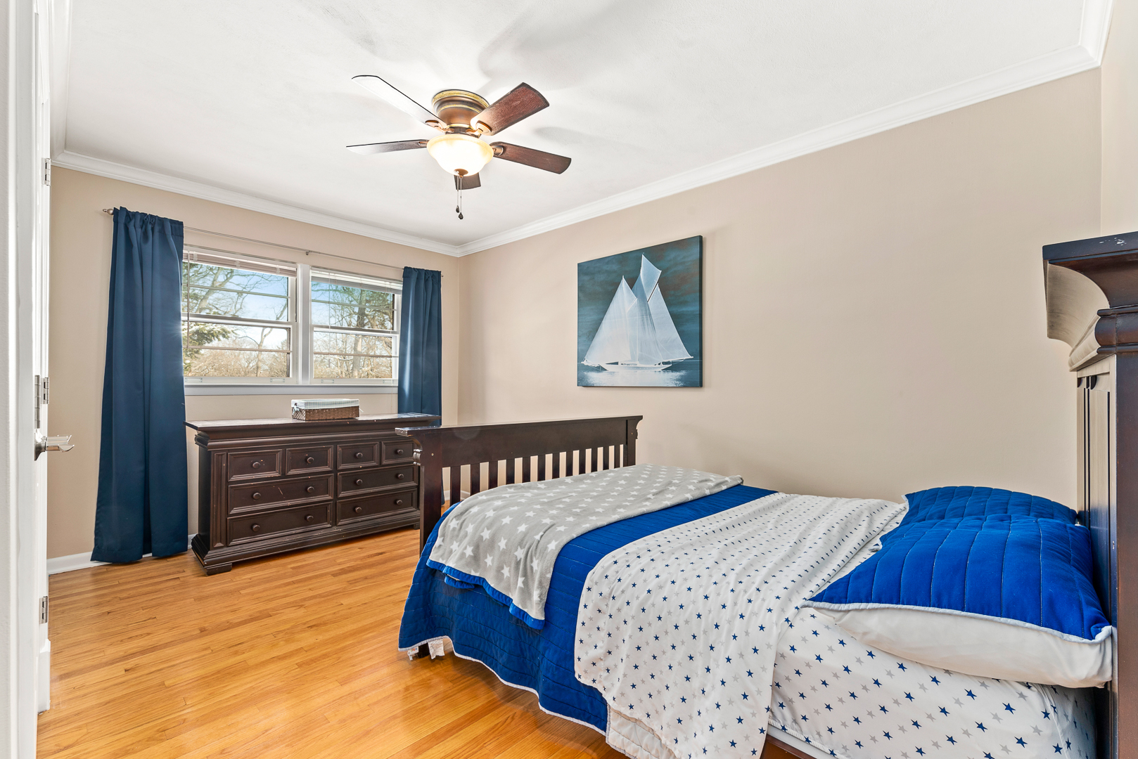 27W420 Manchester Road Winfield, IL 60190 - Photo 17 of 24 a bedroom with a bed and a chandelier