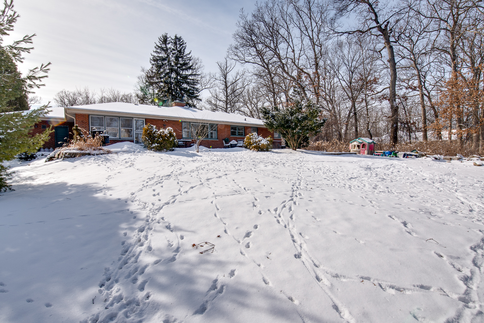 27W420 Manchester Road Winfield, IL 60190 - Photo 22 of 24 a view of a house with a yard covered in snow