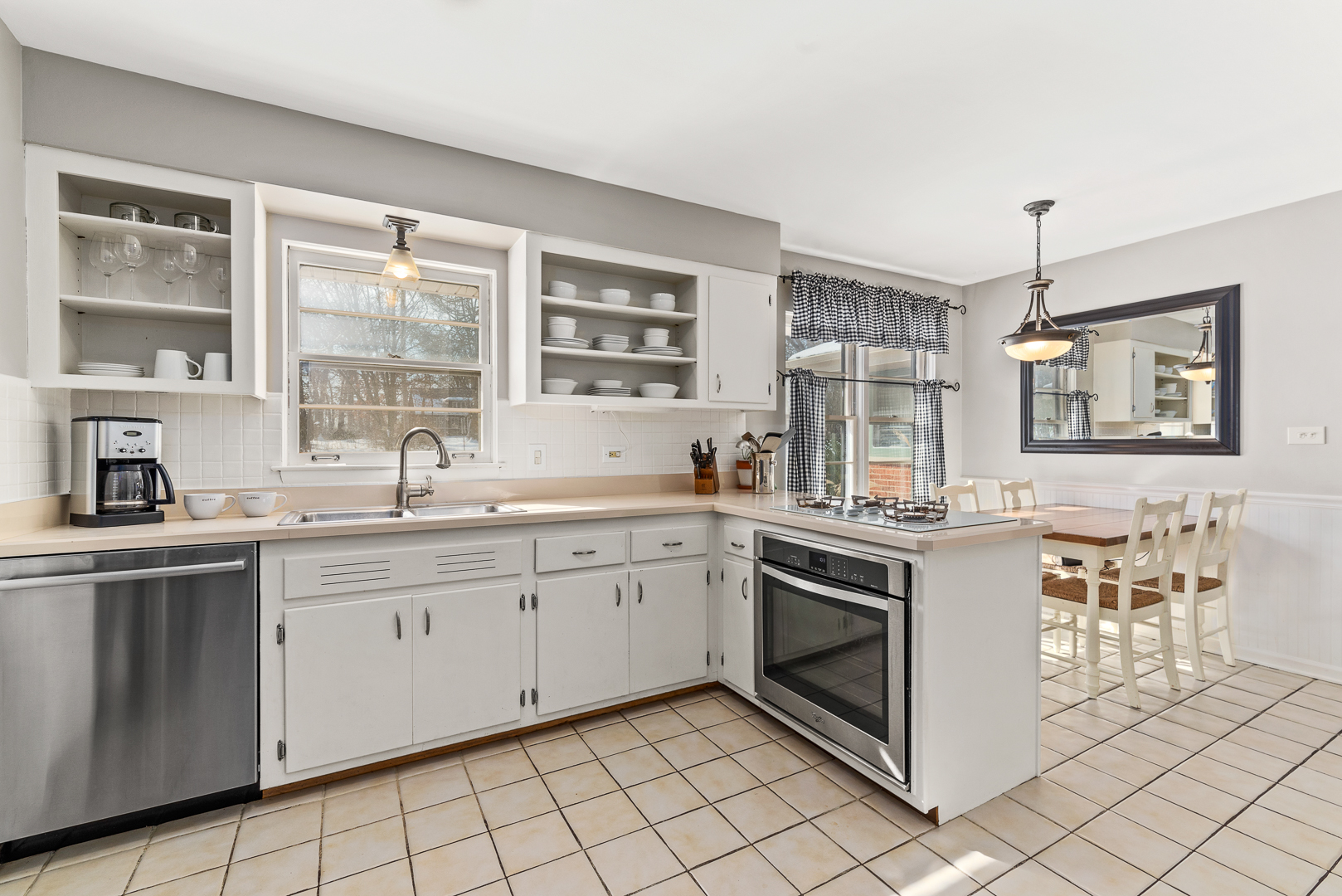 27W420 Manchester Road Winfield, IL 60190 - Photo 7 of 24 a kitchen with a stove sink and cabinets