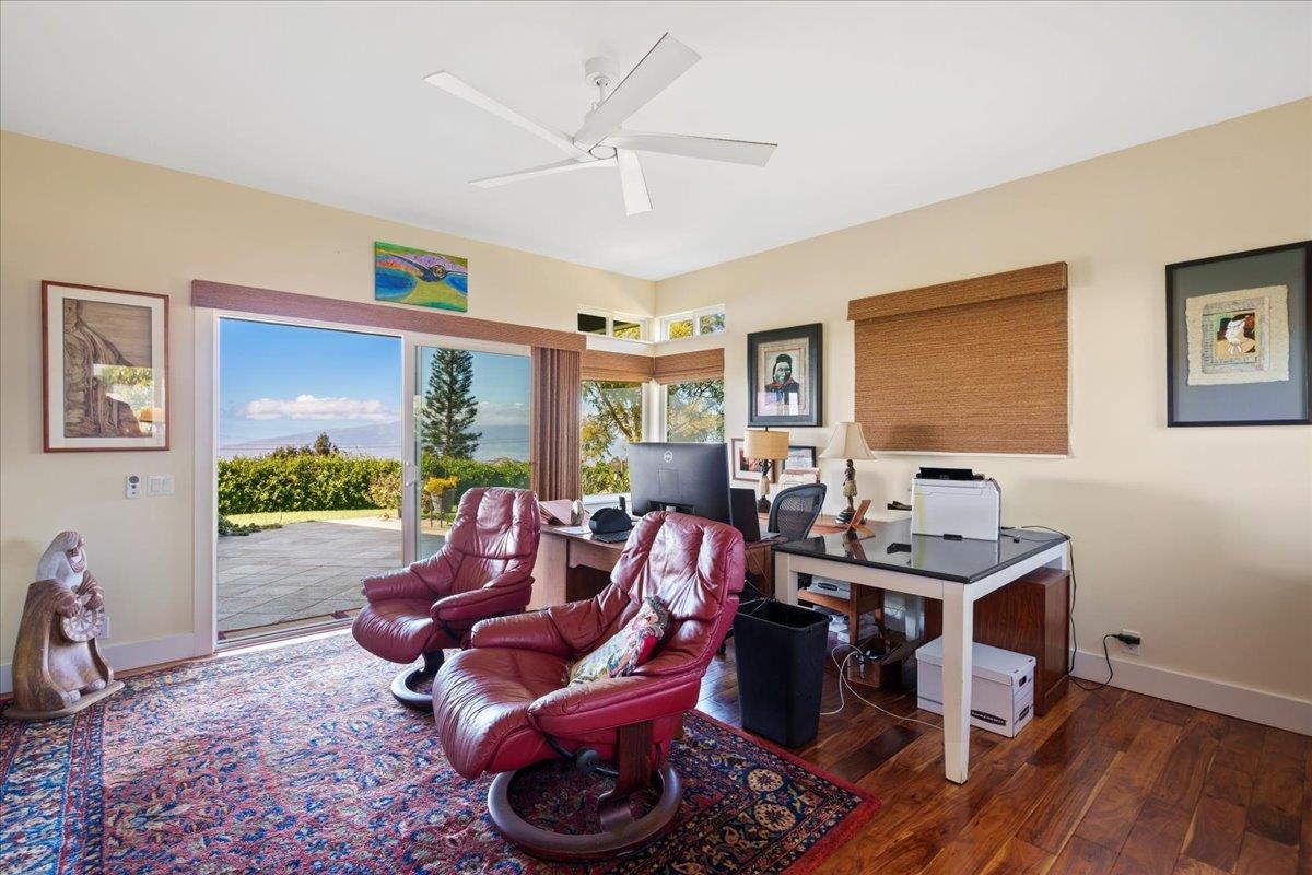 40 Pulehu Road Kula, HI 96790 - Photo 34 of 49 a living room with furniture a window and a flat screen tv