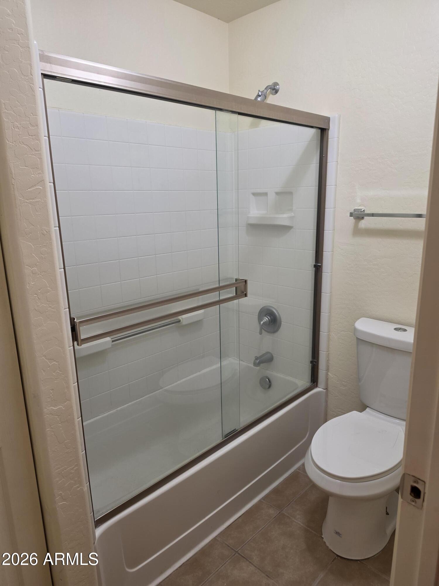537 South Delaware Drive, Unit 104 Apache Junction, AZ 85120 - Photo 12 of 19 a bathroom with a shower and a toilet