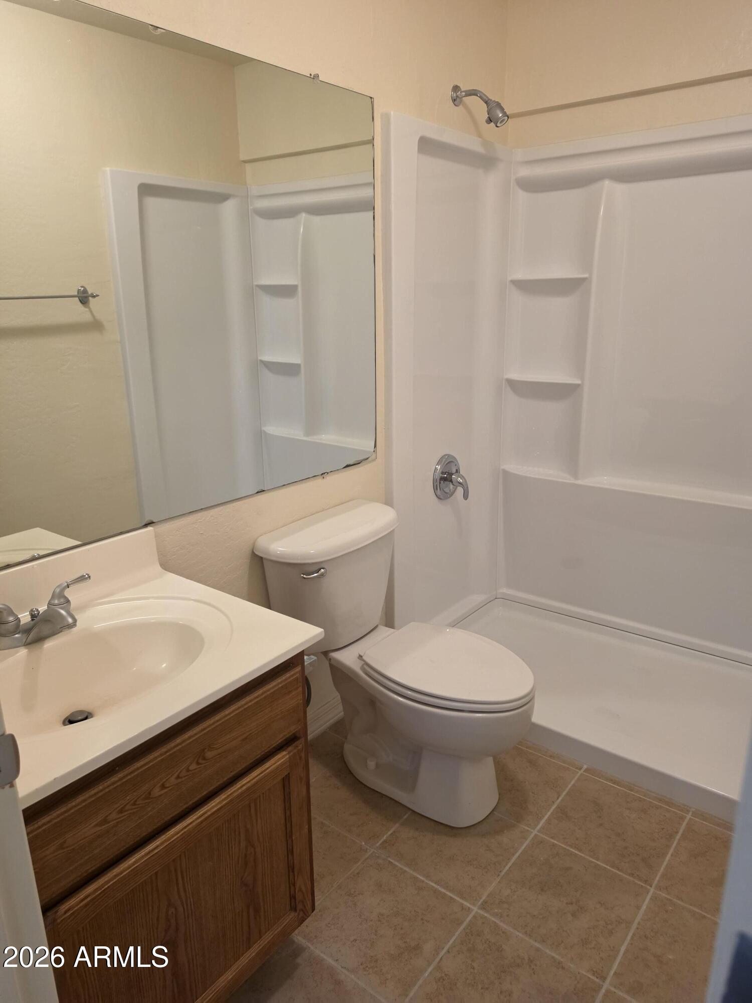 537 South Delaware Drive, Unit 104 Apache Junction, AZ 85120 - Photo 15 of 19 a bathroom with a sink a toilet and shower