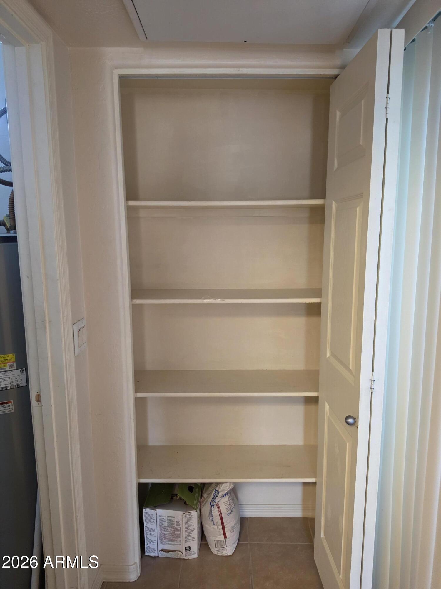 537 South Delaware Drive, Unit 104 Apache Junction, AZ 85120 - Photo 17 of 19 a view of an empty walk in closet