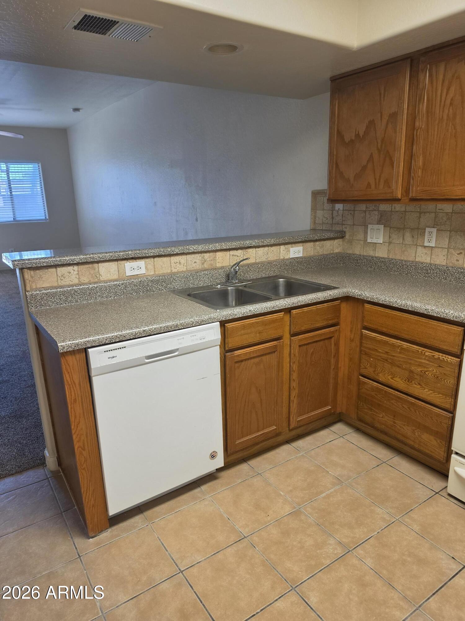 537 South Delaware Drive, Unit 104 Apache Junction, AZ 85120 - Photo 7 of 19 a utility room with sink dryer and washer