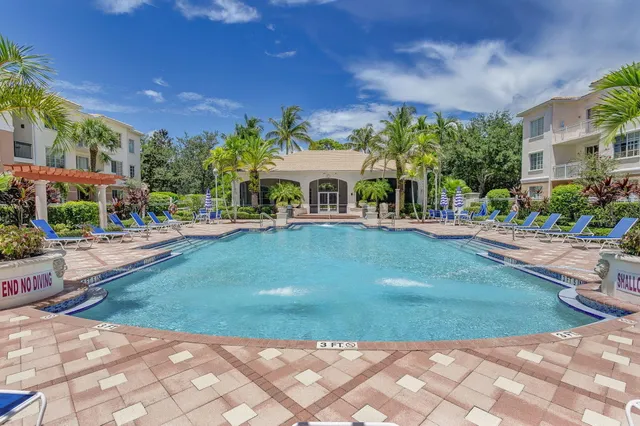 a view of a swimming pool with a patio