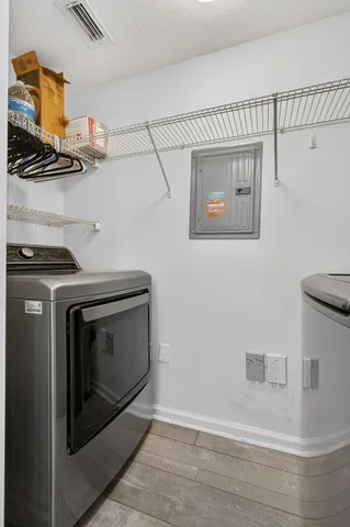 a view of a house with swimming pool and sitting area