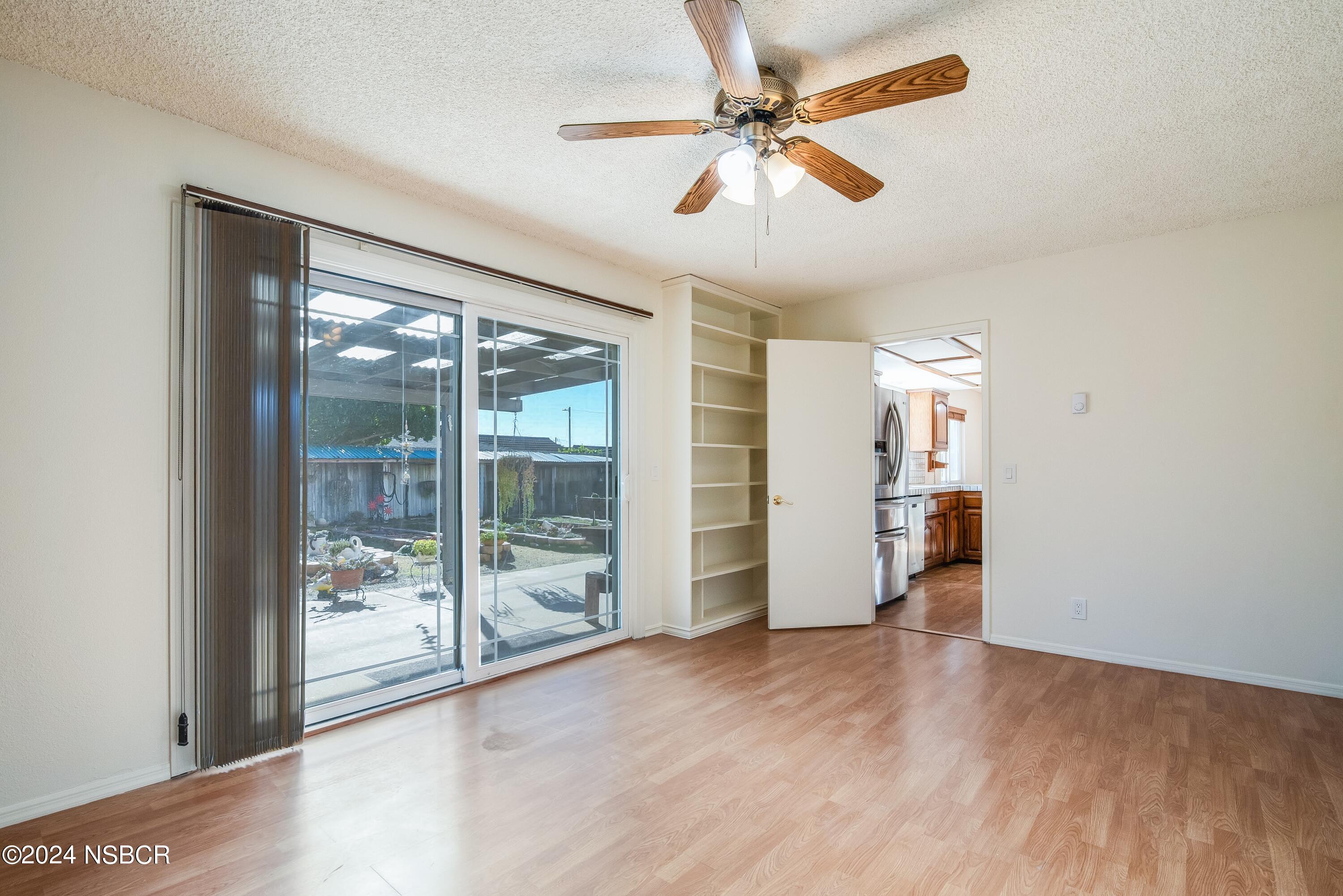 4487 Sirius Avenue Lompoc, CA 93436 - Photo 11 of 32 wooden floor in an empty room with a window
