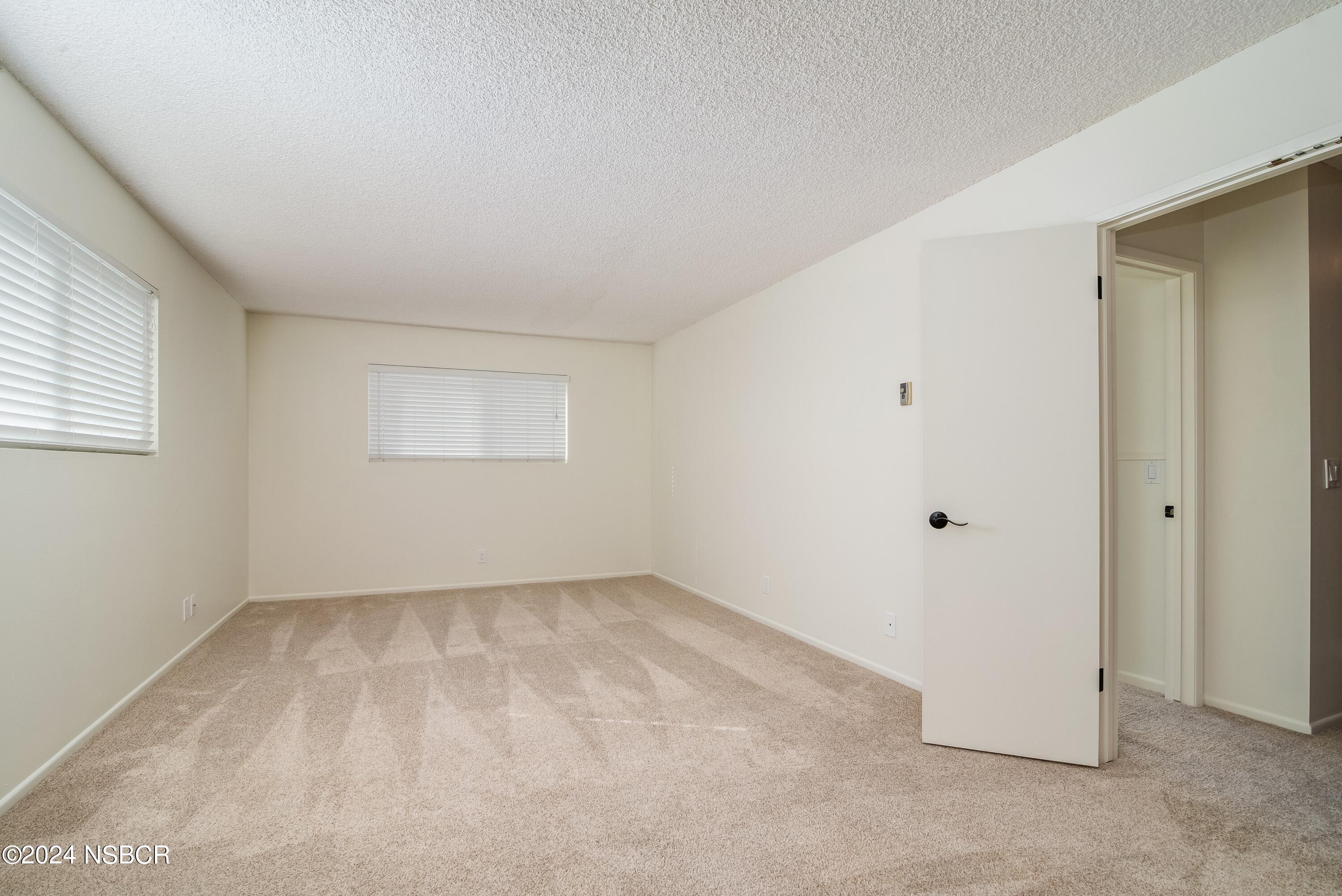 4487 Sirius Avenue Lompoc, CA 93436 - Photo 20 of 32 an empty room with a empty space and windows