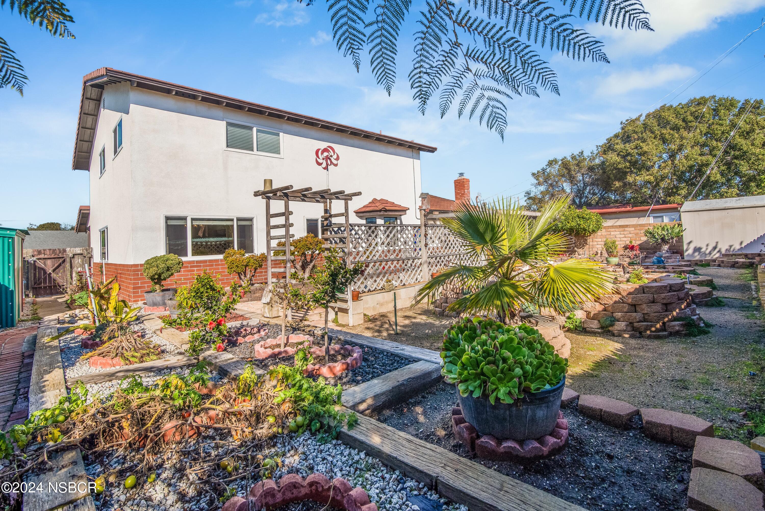 4487 Sirius Avenue Lompoc, CA 93436 - Photo 28 of 32 a front view of a house with a yard