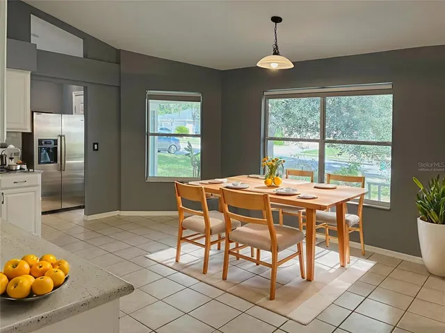a dining room with furniture and window
