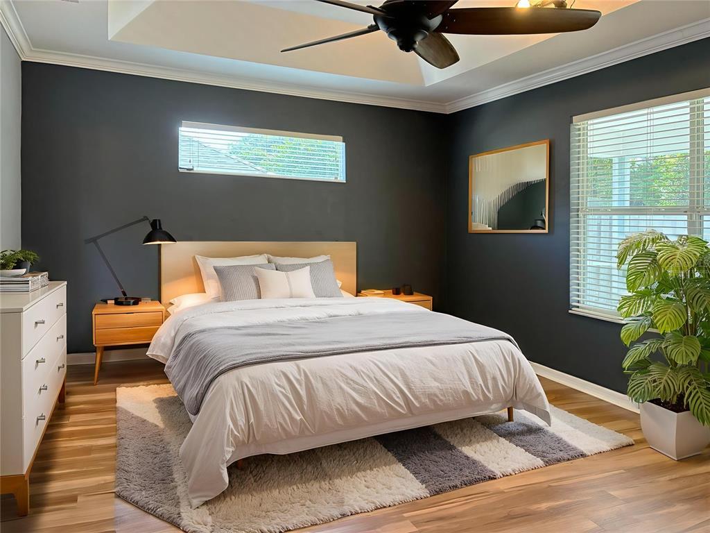 7637 Southwest 49th Place Gainesville, FL 32608 - Photo 16 of 47 a bedroom with a bed and window