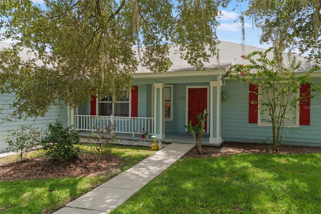 7637 Southwest 49th Place Gainesville, FL 32608 - Photo 2 of 47 a view of a house with backyard and garden