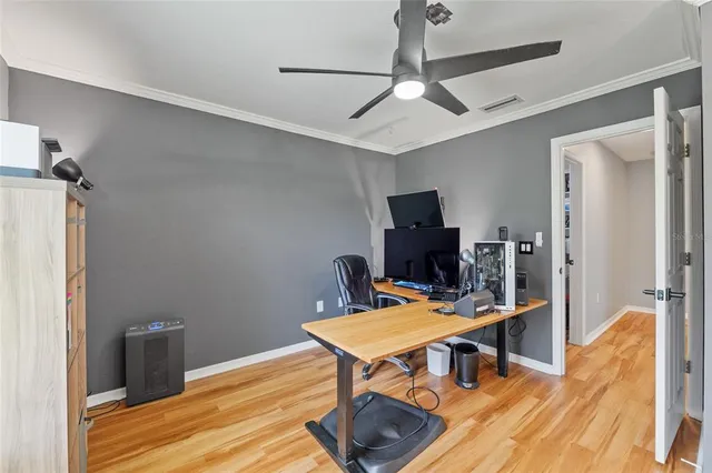 a workspace with furniture and a flat screen tv