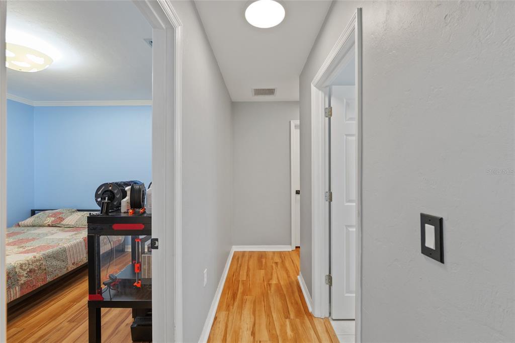 7637 Southwest 49th Place Gainesville, FL 32608 - Photo 26 of 47 a view of a hallway with workspace