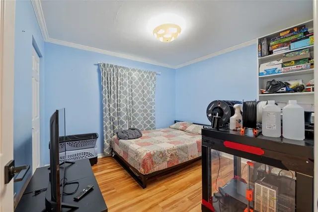 a bedroom with a bed and dresser