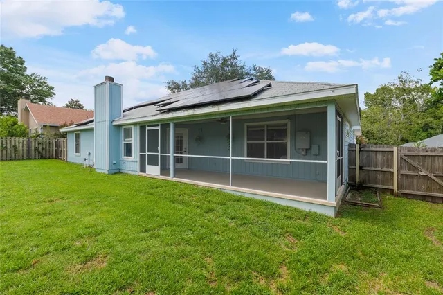 a view of house with yard and entertaining space