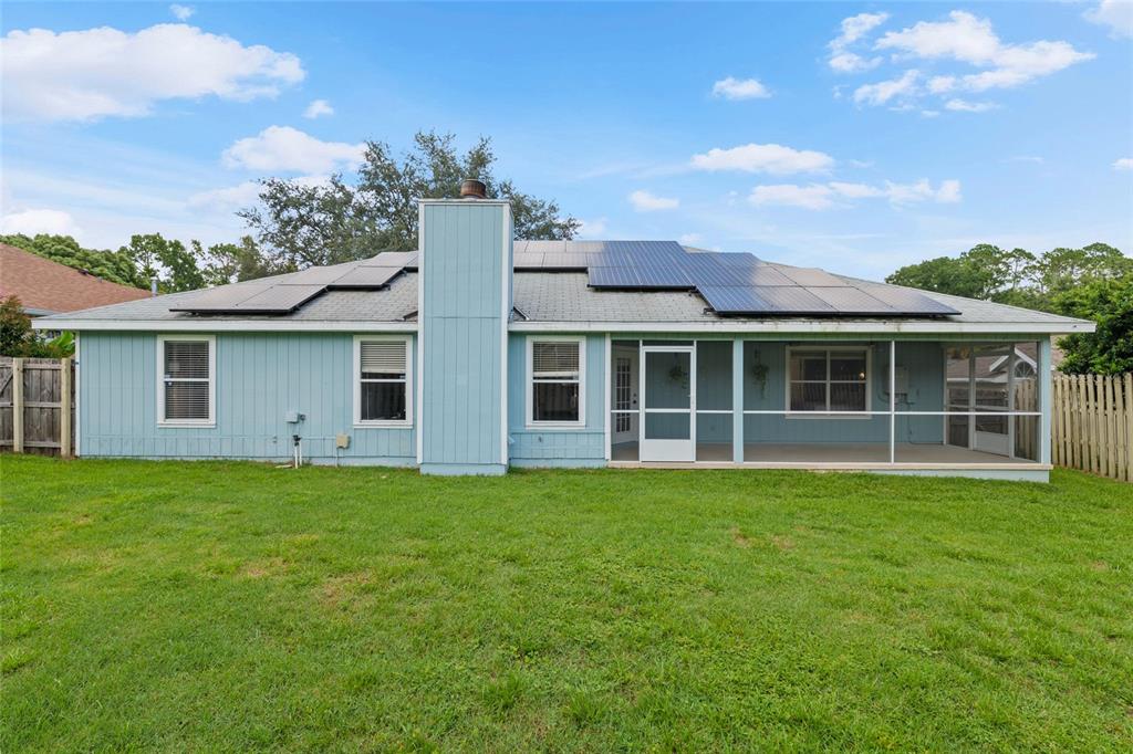 7637 Southwest 49th Place Gainesville, FL 32608 - Photo 36 of 47 a front view of a house with a garden