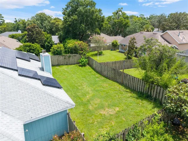 a view of a garden with swimming pool