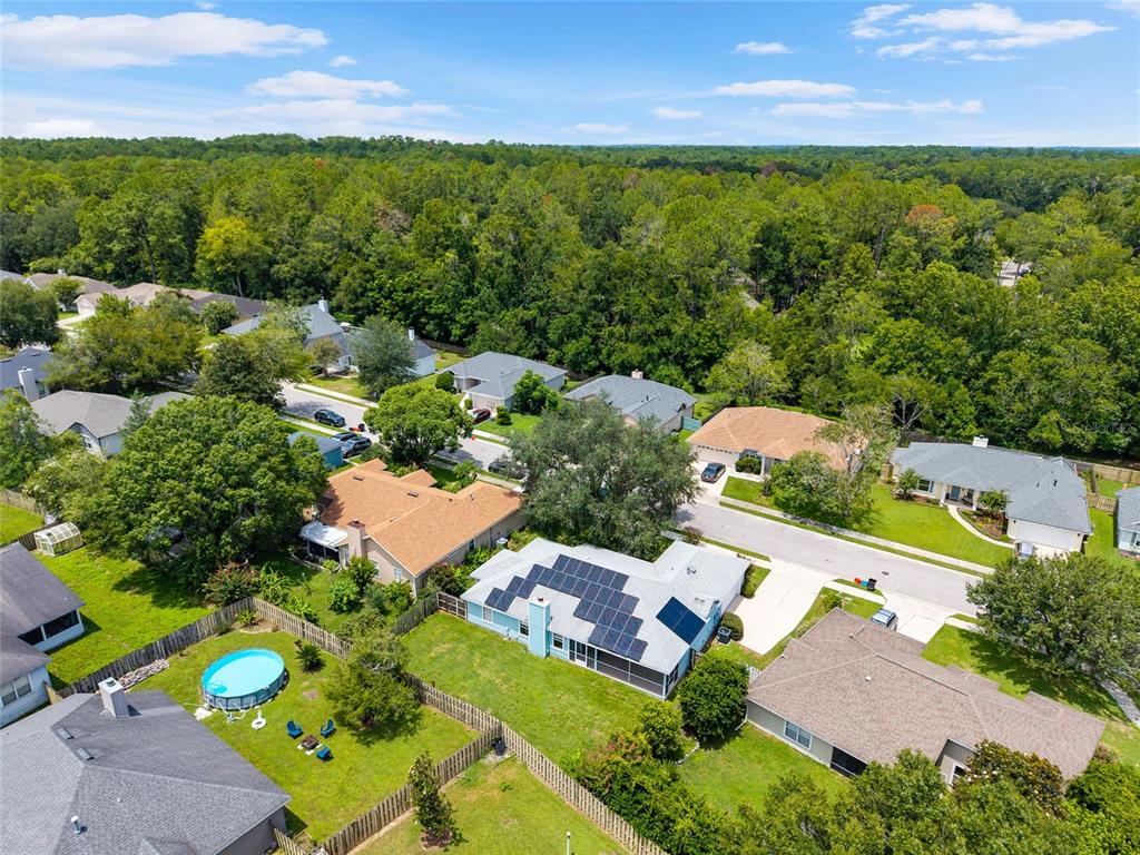 7637 Southwest 49th Place Gainesville, FL 32608 - Photo 42 of 47 an aerial view of residential houses with outdoor space and street view