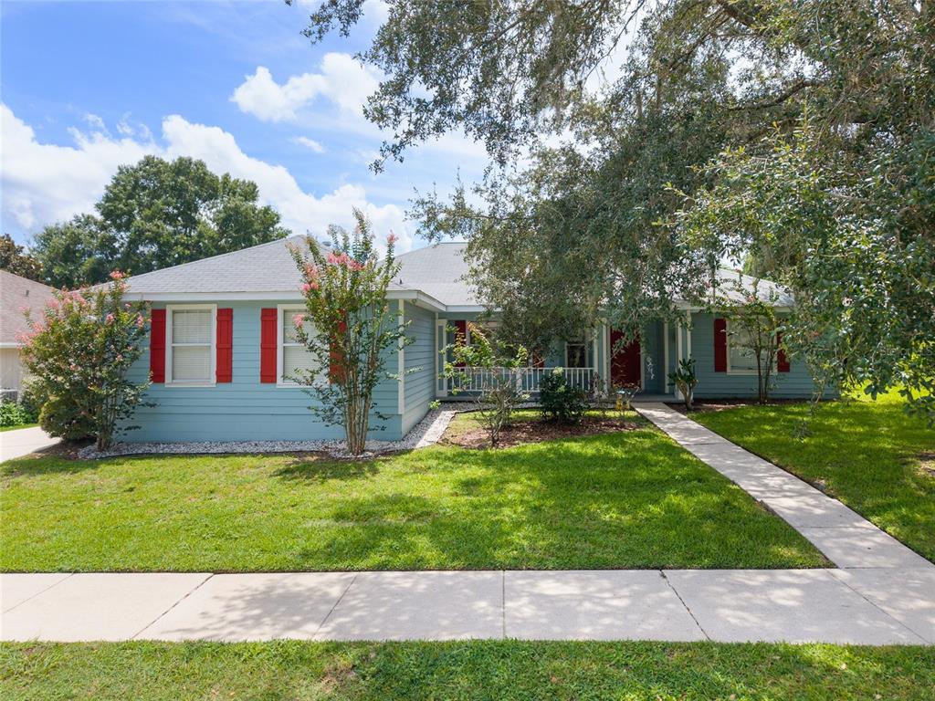7637 Southwest 49th Place Gainesville, FL 32608 - Photo 46 of 47 a view of house with a big yard potted plants and large tree