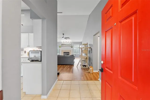a view of a living room with furniture and a window