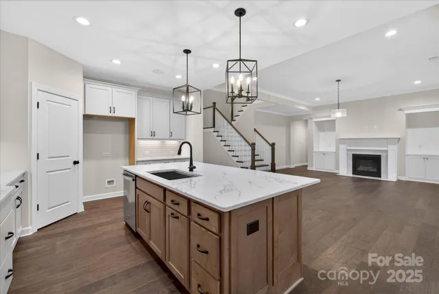 a view of an empty room with window and fire place