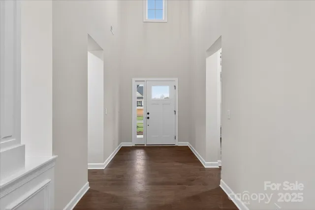 a kitchen with counter top space and wooden floor