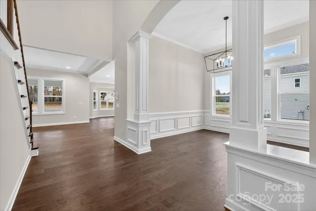 a kitchen with kitchen island granite countertop a sink cabinets and stainless steel appliances