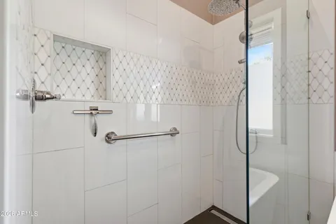 a white bath tub sitting next to a window