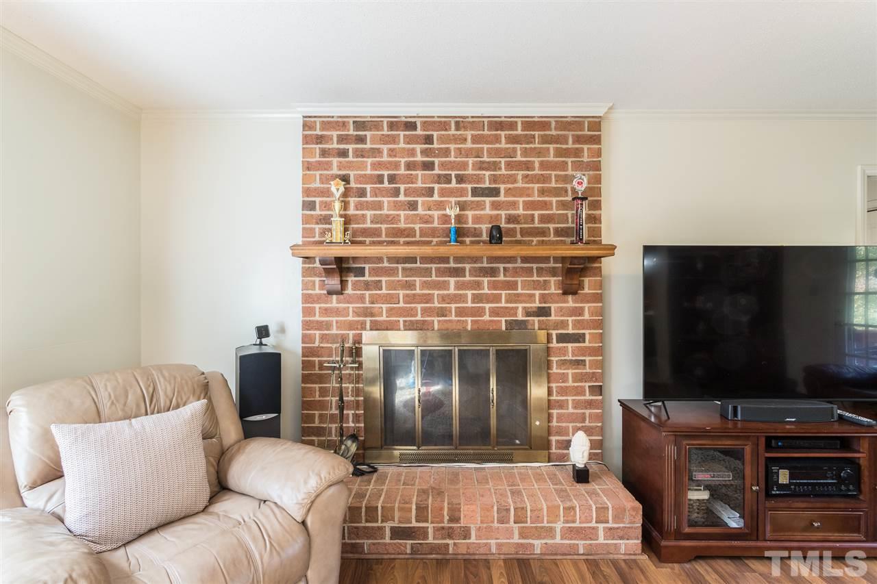 5363 Russell Road Durham, NC 27712 - Photo 11 of 28 a living room with furniture and a flat screen tv