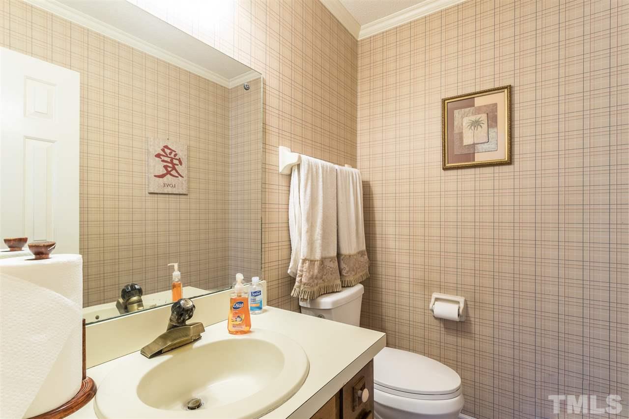 5363 Russell Road Durham, NC 27712 - Photo 16 of 28 a bathroom with a sink toilet and shower