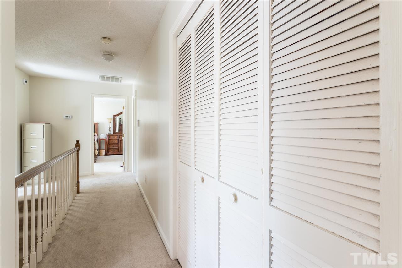 5363 Russell Road Durham, NC 27712 - Photo 17 of 28 a view of a hallway with a white walls