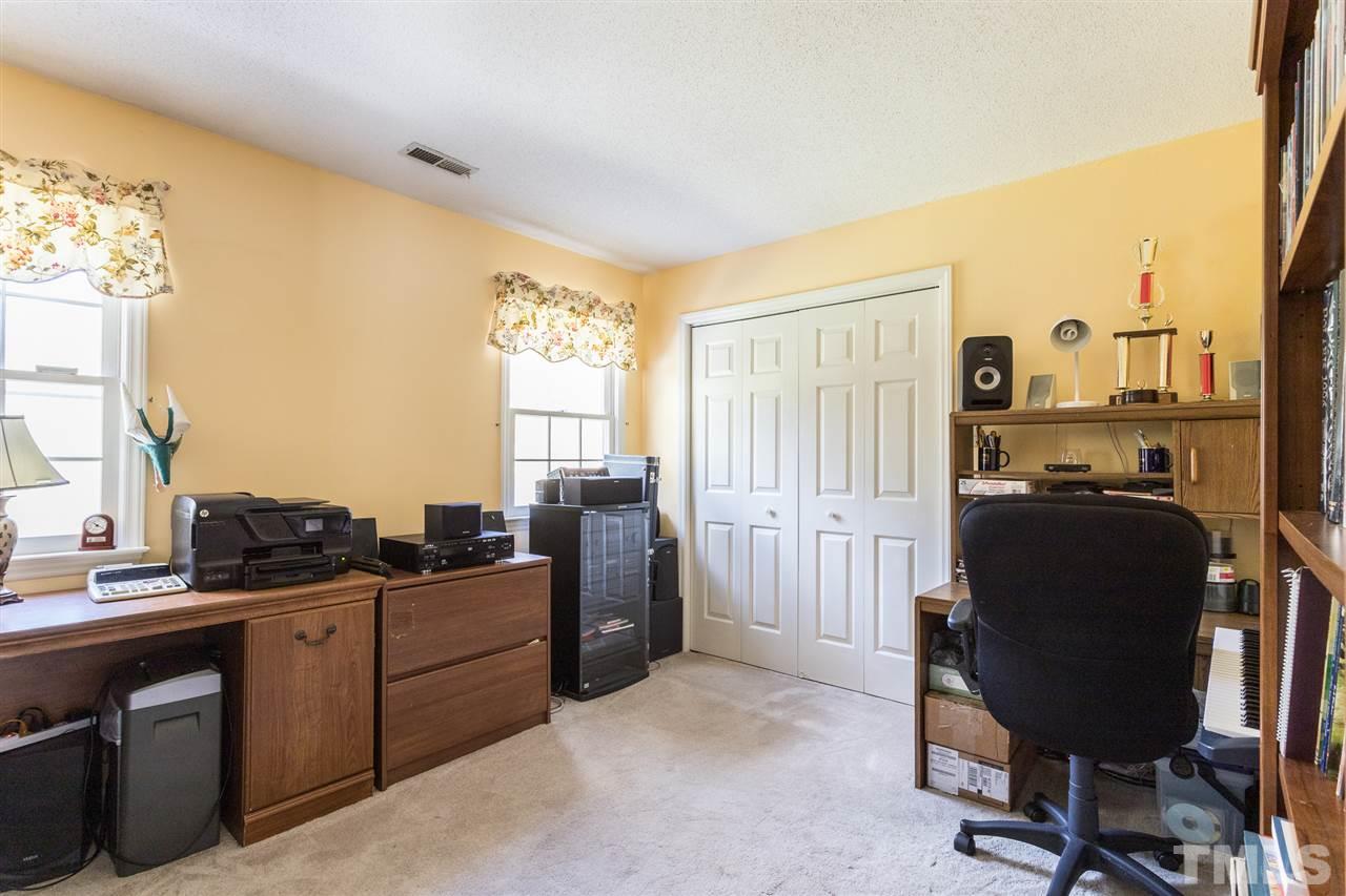 5363 Russell Road Durham, NC 27712 - Photo 21 of 28 a view of a workspace with furniture and a window