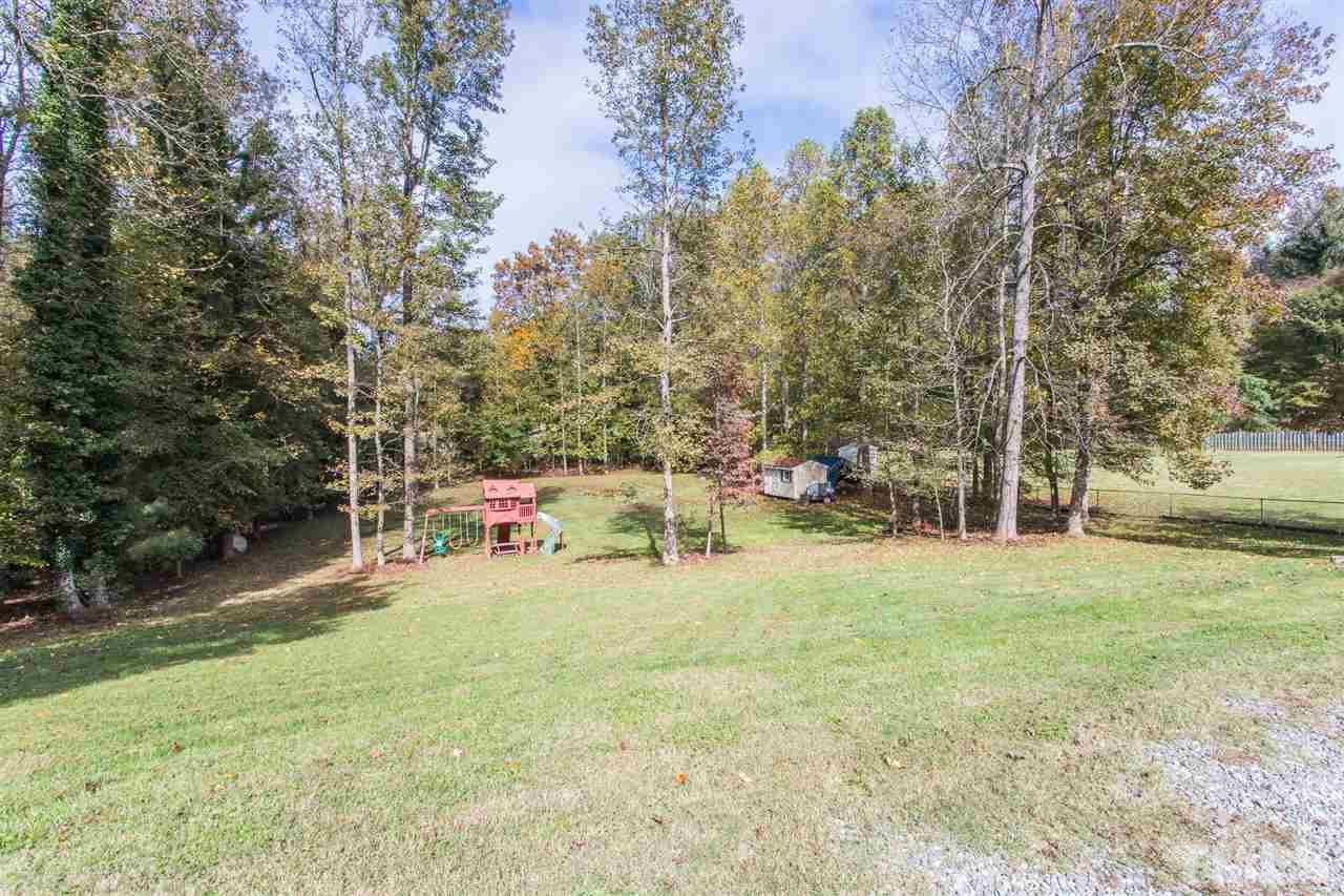 5363 Russell Road Durham, NC 27712 - Photo 26 of 28 a view of yard with swimming pool and sitting area