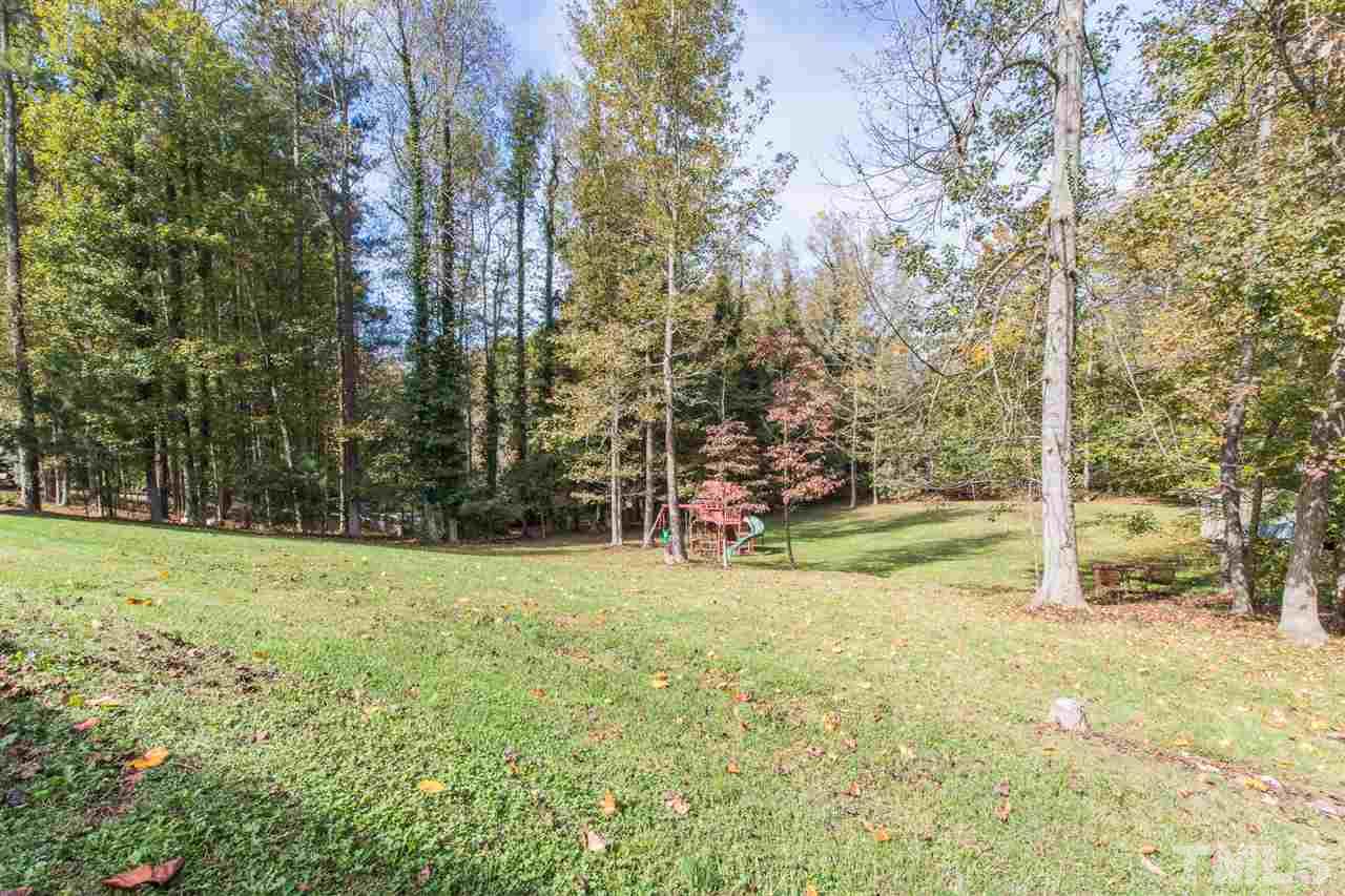 5363 Russell Road Durham, NC 27712 - Photo 27 of 28 a view of a field with trees in the background