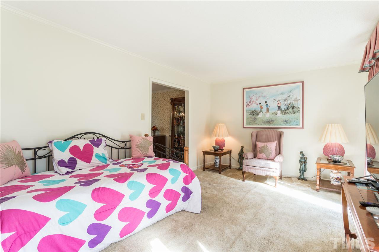 5363 Russell Road Durham, NC 27712 - Photo 6 of 28 a bedroom with a bed and lamp