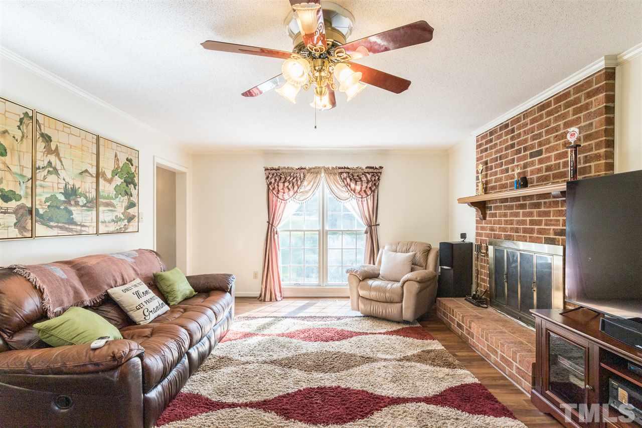 5363 Russell Road Durham, NC 27712 - Photo 10 of 28 a living room with furniture and a flat screen tv