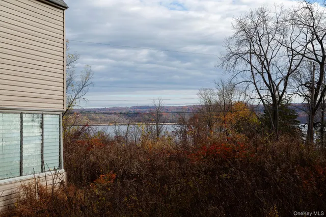 a view of a backyard of the house