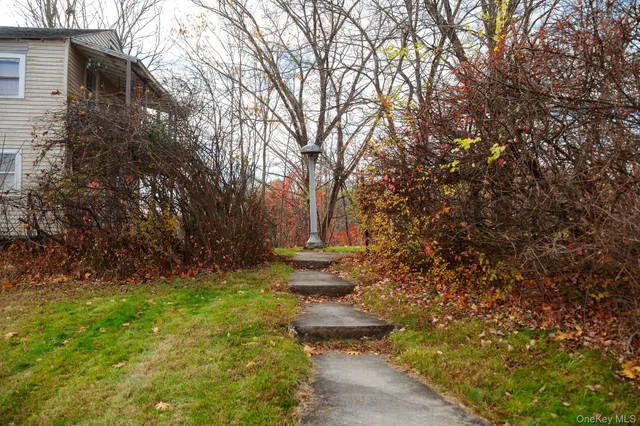 a backyard of a house with lots of green space